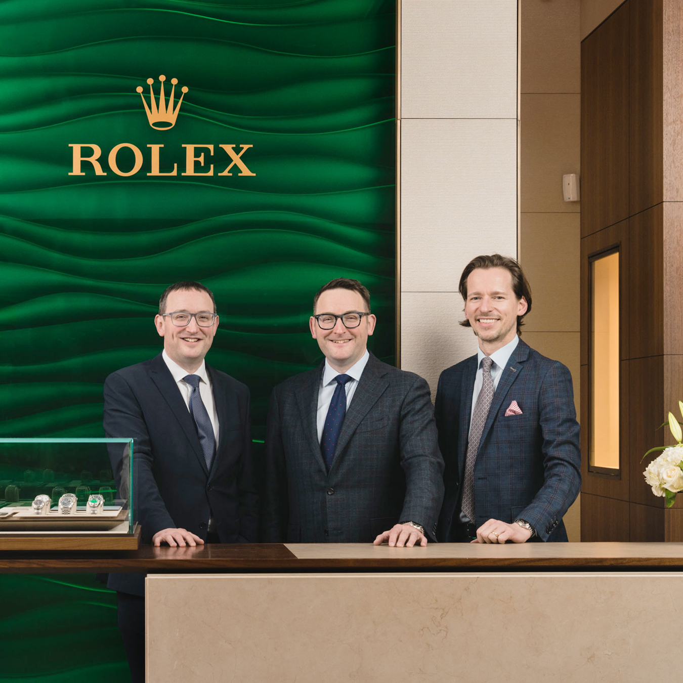Christopher, Phillip and Angus Carry standing in front of the Jamieson & Carry Rolex showroom